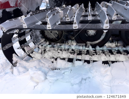 Snowcat machine for snow removal. Preparation ski trails. Snow groomer. Snowy tracks of snowcat in the mountains. Ratrac snowcat. Snow tucker 124671849