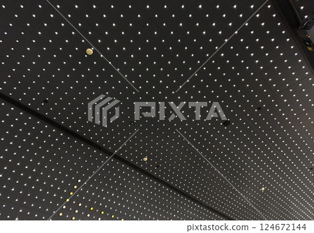 Lights and ventilation system in long line on ceiling of the  industrial building. Exhibition Hall. Ceiling factory construction 124672144