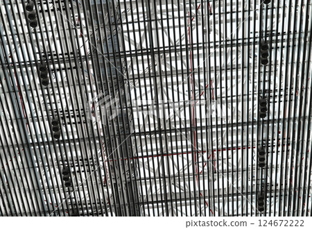 Lights and ventilation system in long line on ceiling of the industrial building. Exhibition Hall. Ceiling factory construction Lights and ventilation system in long line on ceiling of the industrial Lights and ventilation system in long line on ceiling of the industrial building. Exhibition Hall. Ceiling factory construction Lights and ventilation system in long line on ceiling of the industrial 124672222