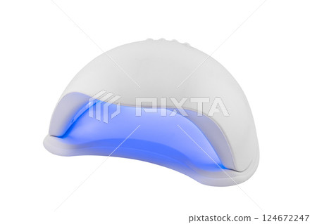 UV LED nail lamp for nails isolated on white background. UV lamp for manicure. Gel polish. Gel polish equipment 124672247