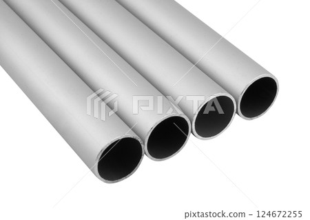 New high quality shiny galvanized stainless steel metal aluminium alloy pipes. Industrial construction materials isolated on white background. New high quality shiny galvanized stainless steel metal aluminium alloy pipes. Industrial construction materials isolated on white background. 124672255