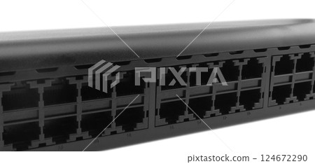 Networking ethernet 24 port switch isolated on white background. Ethernet hub, active hub, network hub, repeater hub, multiport repeater 24 ports with uplink port 124672290