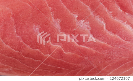 Macro shot yellow fin tuna steak background. Fresh rare steak close up. Raw yellowfin tuna fillet texture. Background fresh tuna meat. Slices of tuna meat 124672307