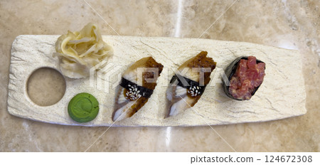 Nigiri sushi on marble plate. Delicious eel nigiri sushi. Nigiri sushi on marble plate. Delicious eel nigiri sushi. 124672308