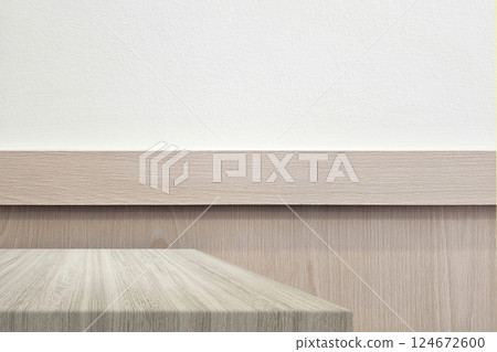 Wooden Table with Minimal Wooden Partition and White Concrete Wall Background in Japandi Style Wooden Table with Minimal Wooden Partition and White Concrete Wall Background in Japandi Style 124672600