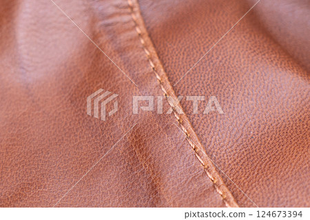 Leather texture background. Part of perforated brown leather details. Perforated leather texture background. Texture leather Leather texture background. Part of perforated brown leather details. Perforated leather texture background. Texture leather 124673394