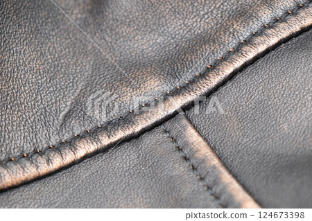 Leather texture background. Part of perforated black leather details. Perforated leather texture background. Texture leather Leather texture background. Part of perforated black leather details. Perforated leather texture background. Texture leather 124673398