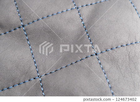 Leather texture background. Part of perforated black leather details. Perforated leather texture background. Texture leather 124673402
