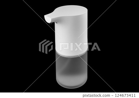 Modern automatic soap dispenser isolated on black background. Sensor soap dispenser 124673411