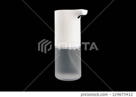 Modern automatic soap dispenser isolated on black background. Sensor soap dispenser Modern automatic soap dispenser isolated on black background. Sensor soap dispenser 124673412