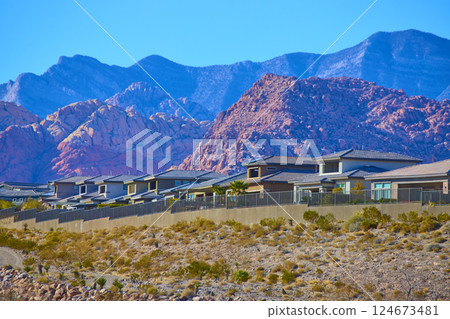 Modern Desert Suburb with Mountain Backdrop Aerial Modern Desert Suburb with Mountain Backdrop Aerial 124673481