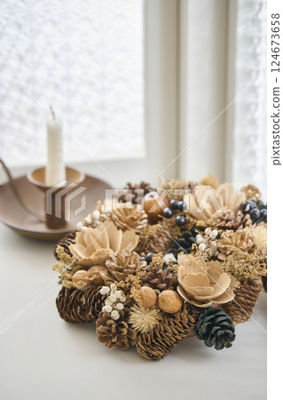 Christmas wreath decorated on a window sill Christmas image 124673658