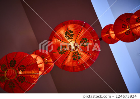 Vibrant Red Chinese Lanterns in Motion Viewed from Below 124673924