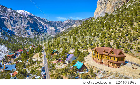 Aerial of Mountain Lodge and Snow-Capped Peaks in Nevada 124673963