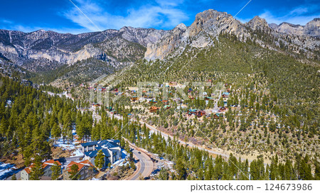 Aerial of Snow-Capped Mt Charleston Village with Evergreen Forests 124673986