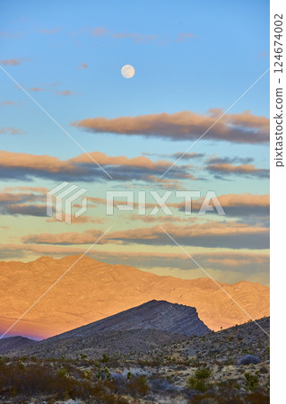 Moonlit Desert Landscape with Mountains at Sunset Eye-Level View Moonlit Desert Landscape with Mountains at Sunset Eye-Level View 124674002
