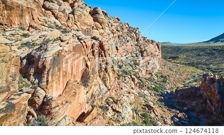 Aerial of Red Rock Formations in Nevada Desert 124674118