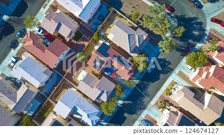 Aerial Top Down of Sustainable Suburban Homes with Solar Panels in Las Vegas Aerial Top Down of Sustainable Suburban Homes with Solar Panels in Las Vegas 124674127
