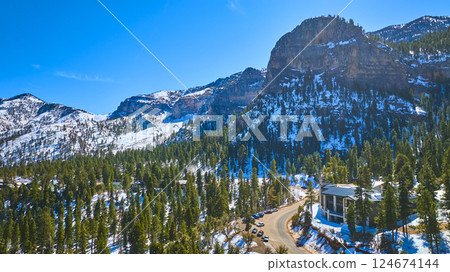Aerial of Snowy Peaks and Winding Road in Mt Charleston Nevada 124674144