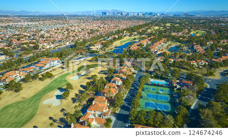 Aerial of Suburban Golf Course and Tennis Courts Near Las Vegas 124674246