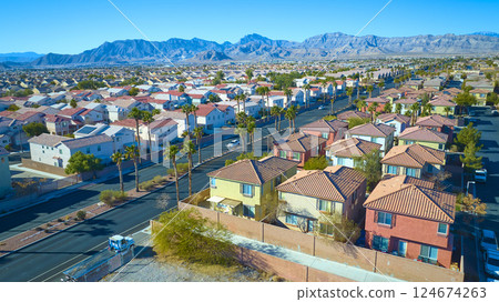 Aerial of Suburban Desert Community with Mountain Backdrop Aerial of Suburban Desert Community with Mountain Backdrop 124674263