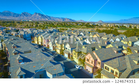 Aerial Suburban Las Vegas Neighborhood with Mountain Backdrop at Golden Hour 124674351