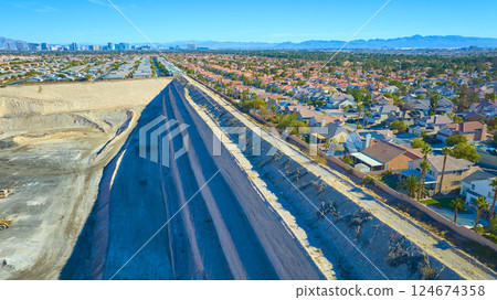 Aerial of Las Vegas Suburb and Excavation Site with City Skyline Aerial of Las Vegas Suburb and Excavation Site with City Skyline 124674358