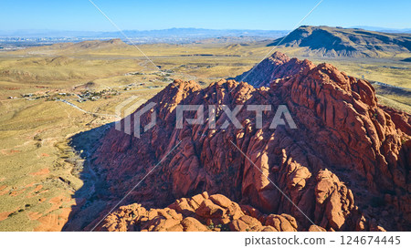 Aerial of Red Rock Canyon with Las Vegas Skyline in Distance 124674445
