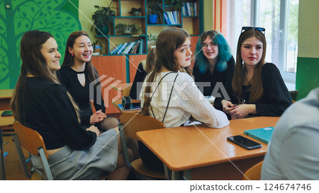 High school girls actively participating and engaging in discussions during a lesson 124674746