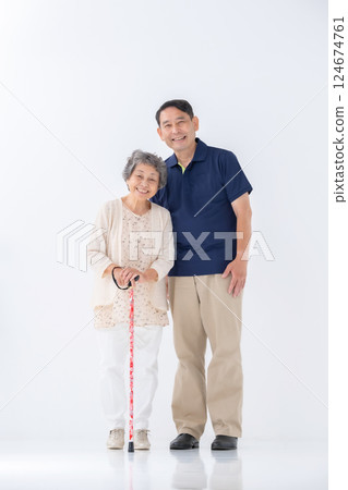 Senior woman and male caregiver, whole body 124674761
