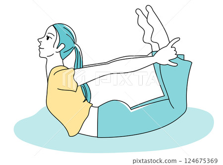 Woman doing yoga bow pose 124675369
