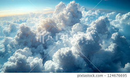 A summer afternoon with a beautiful bouquet of white fluffy clouds drifting across a bright clear sky 124676695