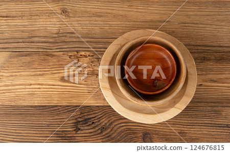 Empty wood bowl on table, plate stack on wooden table, light rustic dish mockup fabric, eco bio Empty wood bowl on table, plate stack on wooden table, light rustic dish mockup fabric, eco bio 124676815