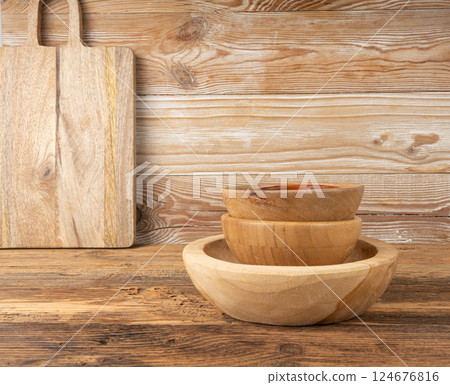 Empty wood bowl on table, plate stack on wooden table, light rustic dish mockup, eco bio Empty wood bowl on table, plate stack on wooden table, light rustic dish mockup, eco bio 124676816