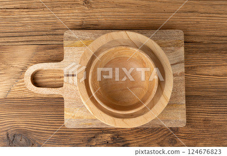 Empty wood bowl on table, plate stack on wooden table, light rustic dish mockup, eco bio Empty wood bowl on table, plate stack on wooden table, light rustic dish mockup, eco bio 124676823