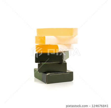 Hotel soap in a package isolated, hand made travel body care cosmetic, hotel shampoo kit Hotel soap in a package isolated, hand made travel body care cosmetic, hotel shampoo kit 124676841