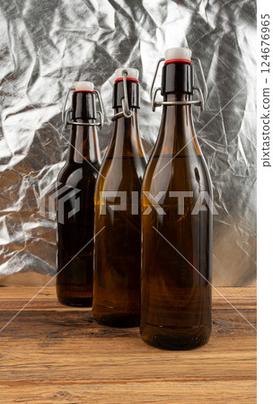 Old beer bottle, brown glass vintage beerbottle, a quality traditional time-tested drink symbol 124676965