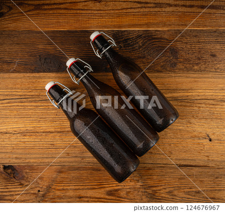 Old beer bottle, brown glass vintage beerbottle, a quality traditional time-tested drink symbol 124676967
