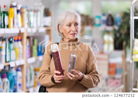 Mature woman choosing hair spray 124677232