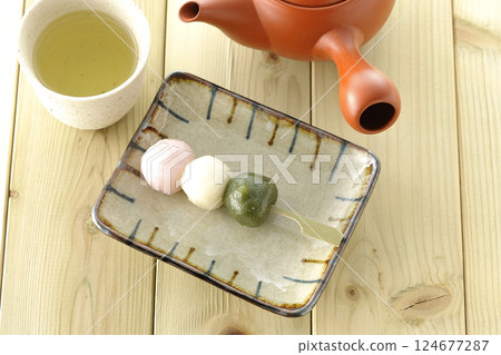 Tea and three color dumplings Tea and three color dumplings 124677287