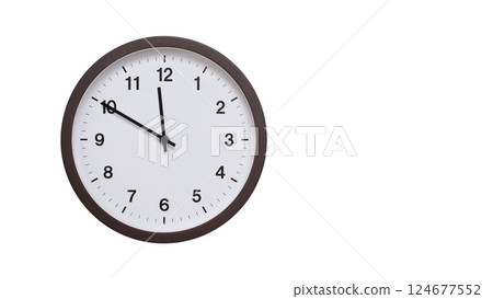 A simple round wall clock with a dark brown frame and a white face displaying 11:50/23:50. Isolated on a white background, perfect for time-related concepts, deadlines, and schedule themes. A simple round wall clock with a dark brown frame and a white face displaying 11:50/23:50. Isolated on a white background, perfect for time-related concepts, deadlines, and schedule themes. 124677552