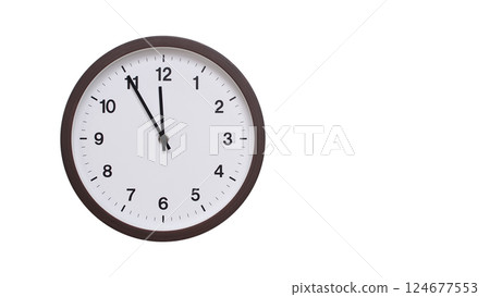 A simple round wall clock with a dark brown frame and a white face displaying 11:55/23:55. Isolated on a white background, perfect for time-related concepts, deadlines, and schedule themes. A simple round wall clock with a dark brown frame and a white face displaying 11:55/23:55. Isolated on a white background, perfect for time-related concepts, deadlines, and schedule themes. 124677553