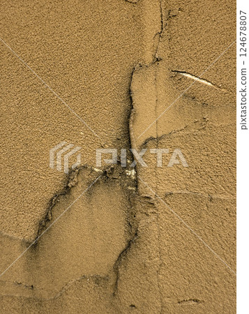 A wall with a rich vintage texture that is good for use as a design background. A wall with a rich vintage texture that is good for use as a design background. 124678807