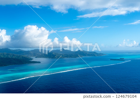Aerial view of Tahaa island, French Polynesia, with turquoise lagoon and reef 124679104