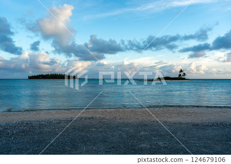 Sunset over two tropical motu on Tikehau Atoll, French Polynesia 124679106