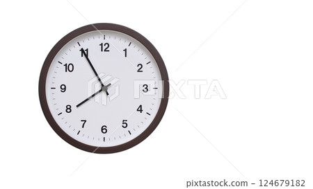 A simple round wall clock with a dark brown frame and a white face displaying 07:55/19:55. Isolated on a white background, perfect for time-related concepts, deadlines, and schedule themes. 124679182