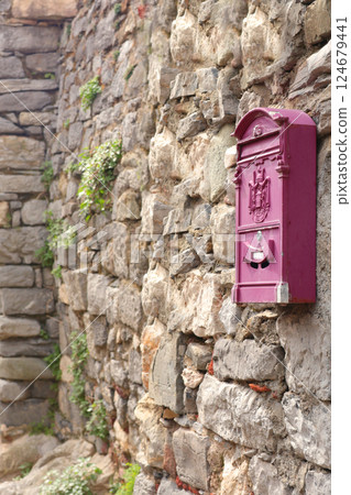 Mailbox on stone wall in bay of Porto Venere, Liguria. Sea and tourism in Italy. Traditional buildings. Background for design.  124679441