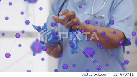 Medical professional putting on gloves, surrounded by healthcare icons image Medical professional putting on gloves, surrounded by healthcare icons image 124679711