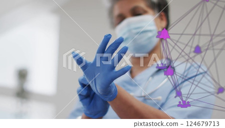 Healthcare professional wearing gloves, network of connections image over scene 124679713