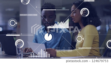 Business data analytics image over two colleagues discussing documents in office Business data analytics image over two colleagues discussing documents in office 124679753